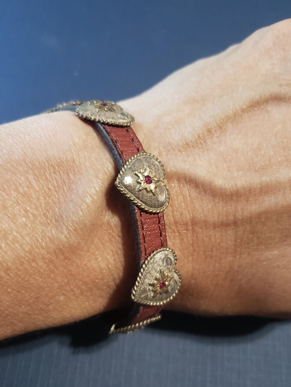 Vintage-Inspired Red Leather Heart Bracelet with Gold Accents
